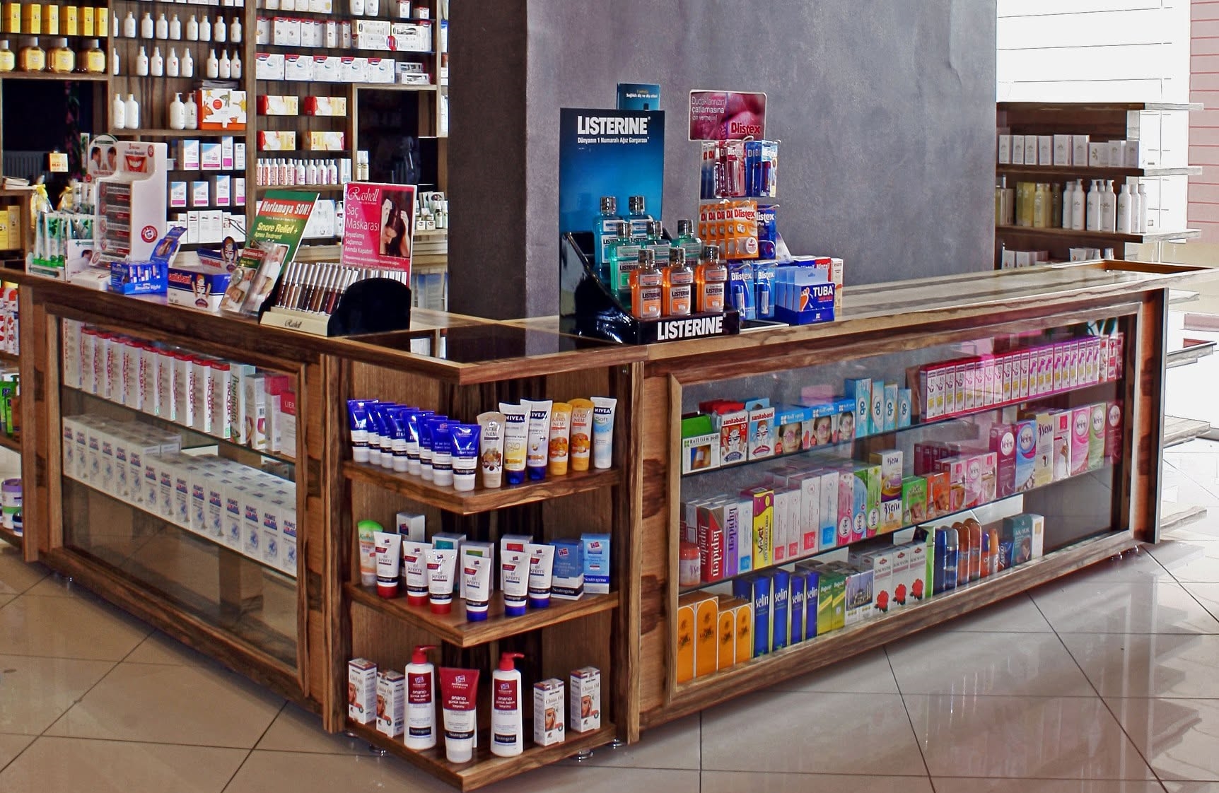 Custom luxury pharmacy dispensing counter with glass display cabinets by Pharm Art Studio