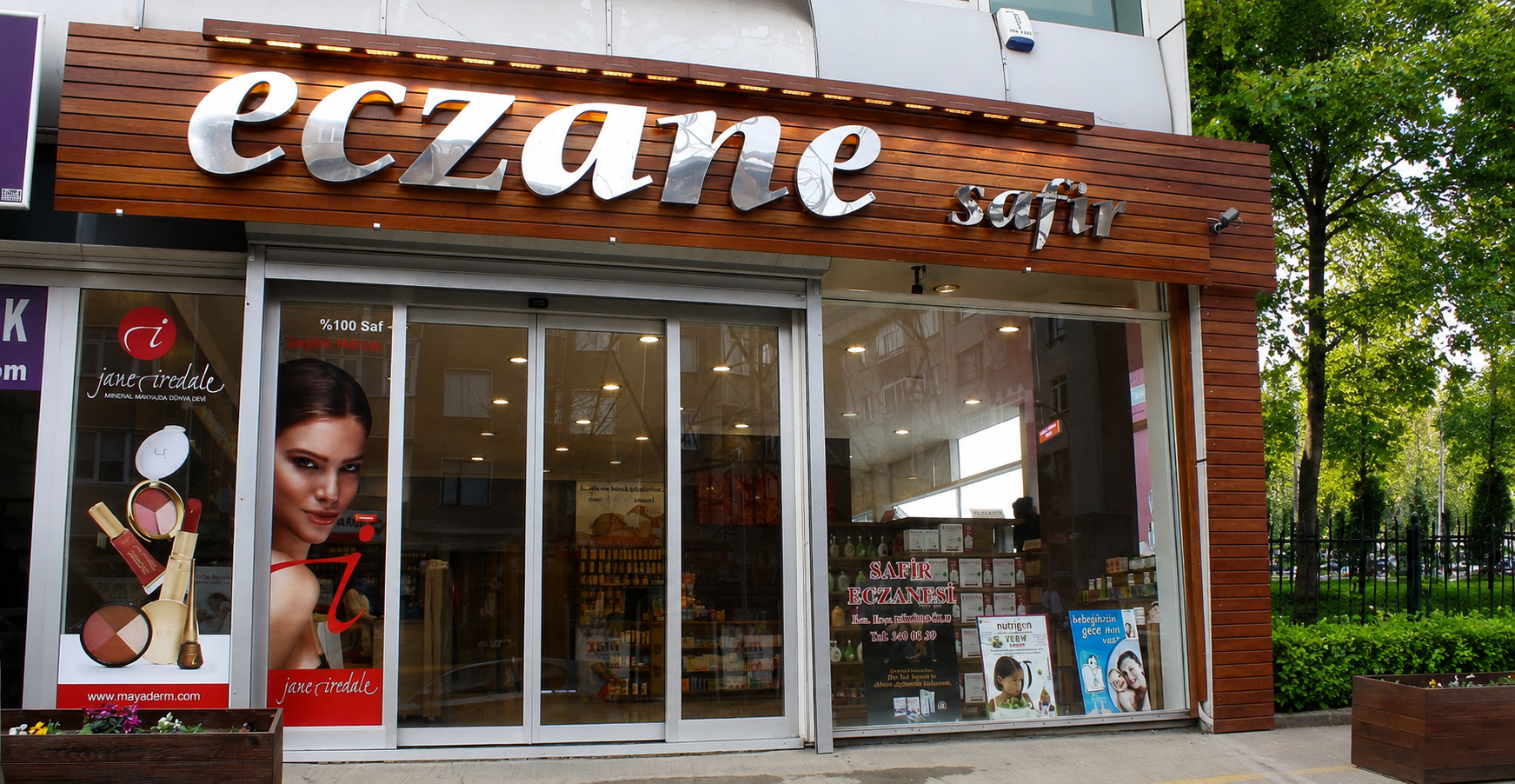Luxury pharmacy exterior design with brushed chrome signage and premium wooden facade by Pharm Art Studio