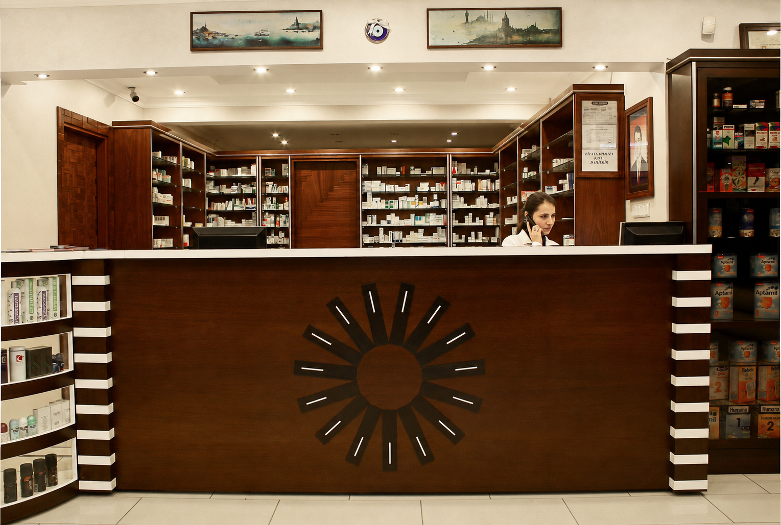 Traditional pharmacy interior with custom mahogany cabinetry and a sculptural wooden counter
