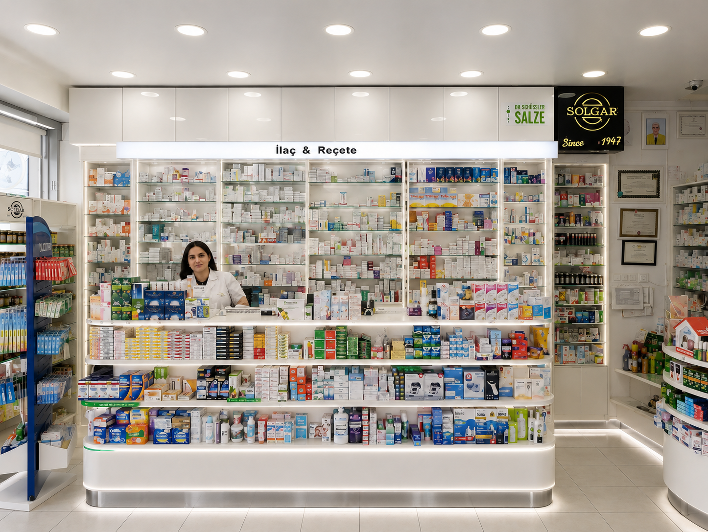 Modern white pharmacy interior with dispensing counter, medicine shelving and retail product displays designed by Pharm Art Studio